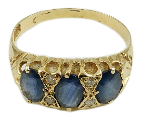 An Edwardian 15ct gold and three stone oval cut sapphire set half hoop ring, with diamond chip spacers, size Q, gross weight 2.4 grams. Condition - poor to fair